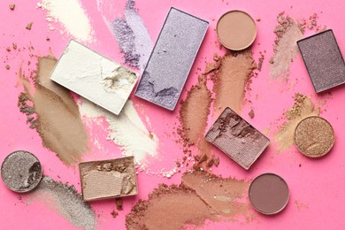 Photo of Beautiful eyeshadow refill pans on pink background, flat lay