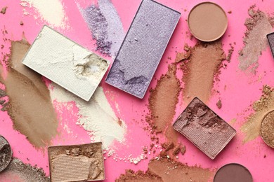Photo of Beautiful eyeshadow refill pans on pink background, flat lay