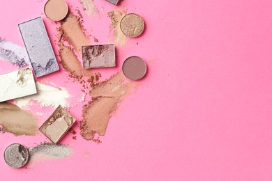 Photo of Beautiful eyeshadow refill pans on pink background, flat lay. Space for text