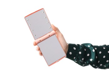 Photo of Woman holding open pocket mirror on white background, closeup