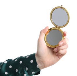 Photo of Woman holding open pocket mirror on white background, closeup