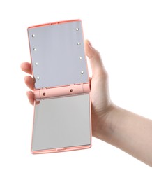 Photo of Woman holding open pocket mirror on white background, closeup
