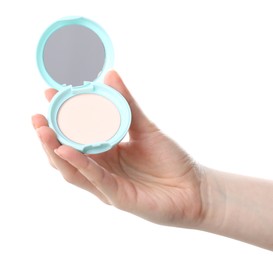 Photo of Woman holding open face powder with mirror on white background, closeup