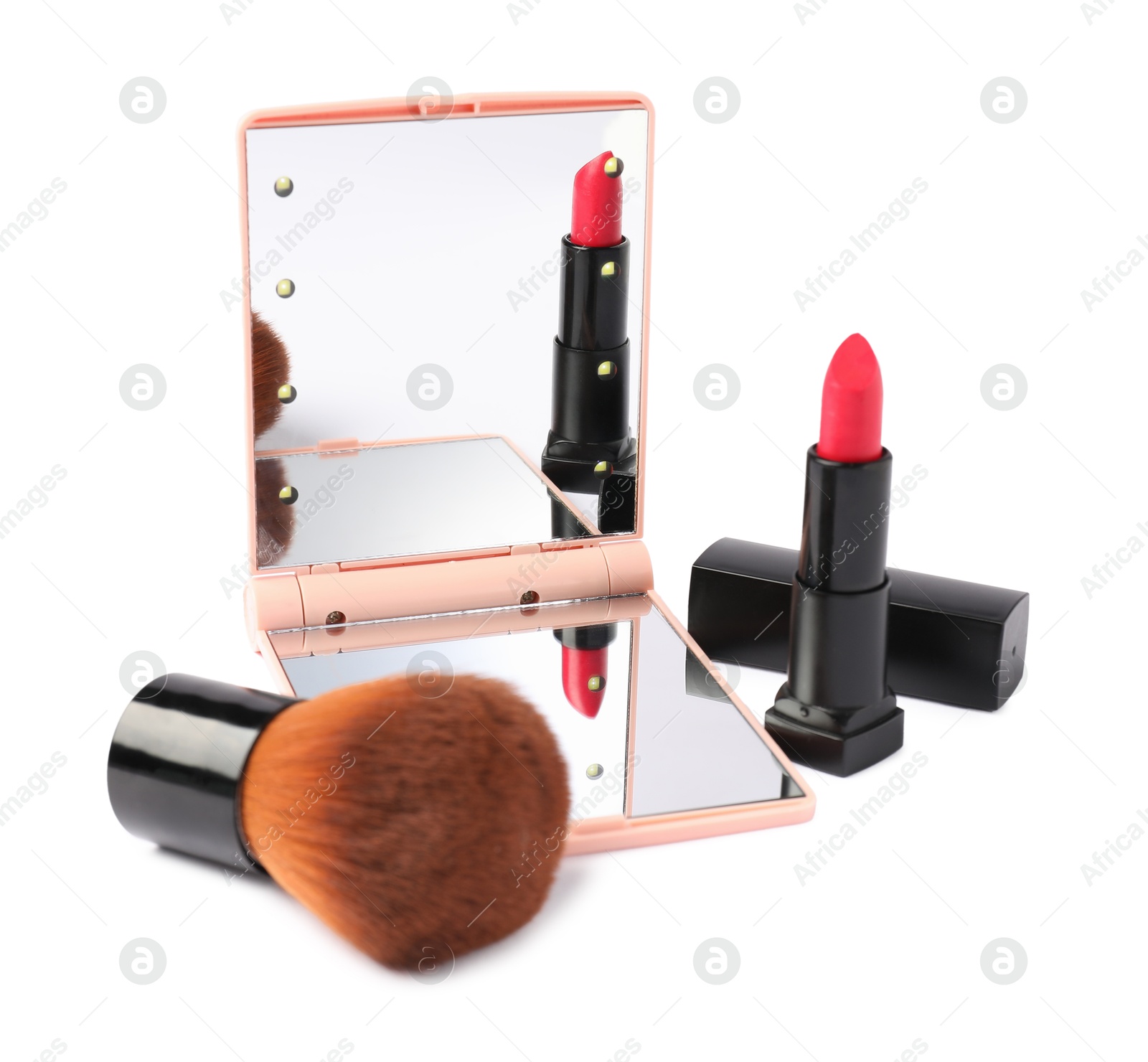 Open pocket mirror, brush and lipstick isolated on white Photo of Open pocket mirror, brush and lipstick isolated on white