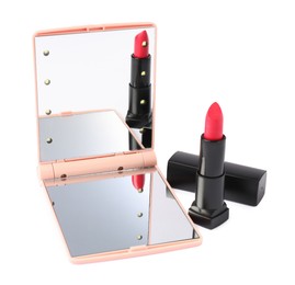 Photo of Open pocket mirror and lipstick isolated on white