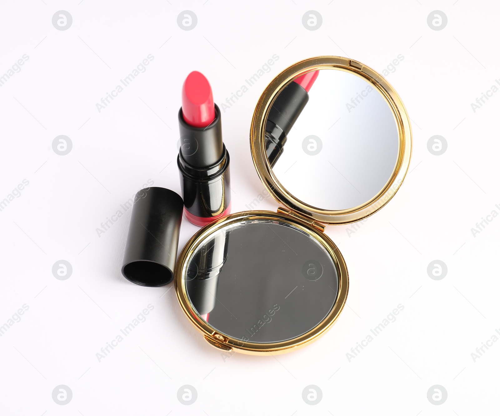Open pocket mirror and lipstick isolated on white, above view Photo of Open pocket mirror and lipstick isolated on white, above view