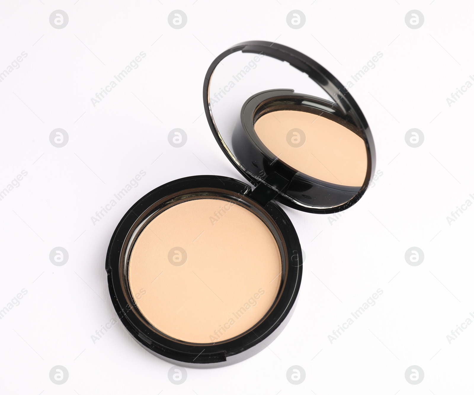 Open face powder with mirror on white background, above view Photo of Open face powder with mirror on white background, above view