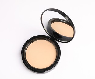 Photo of Open face powder with mirror on white background, above view