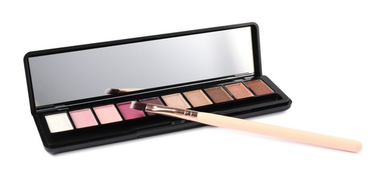 Photo of Eyeshadow palette with mirror and brush isolated on white