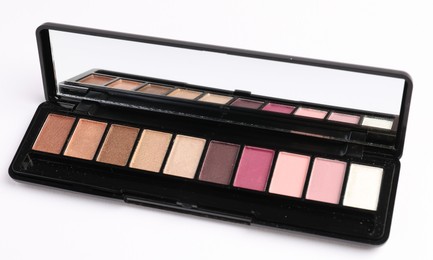 Photo of Eyeshadow palette with mirror isolated on white