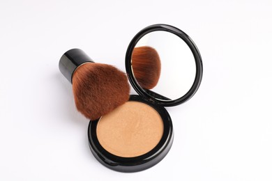 Photo of Open face powder with mirror and brush on white background, above view