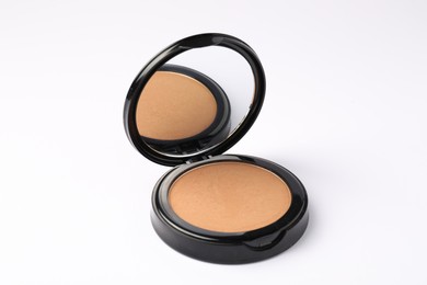 Photo of Open face powder with mirror on white background