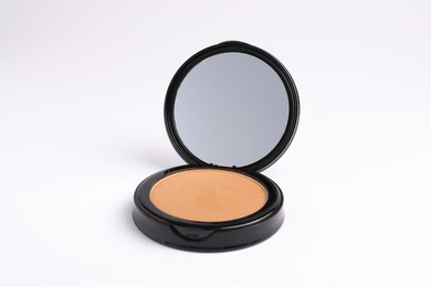 Photo of Open face powder with mirror on white background