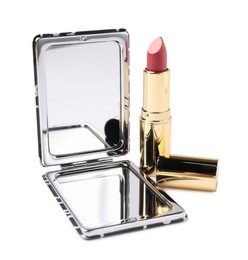 Photo of Open pocket mirror and lipstick isolated on white