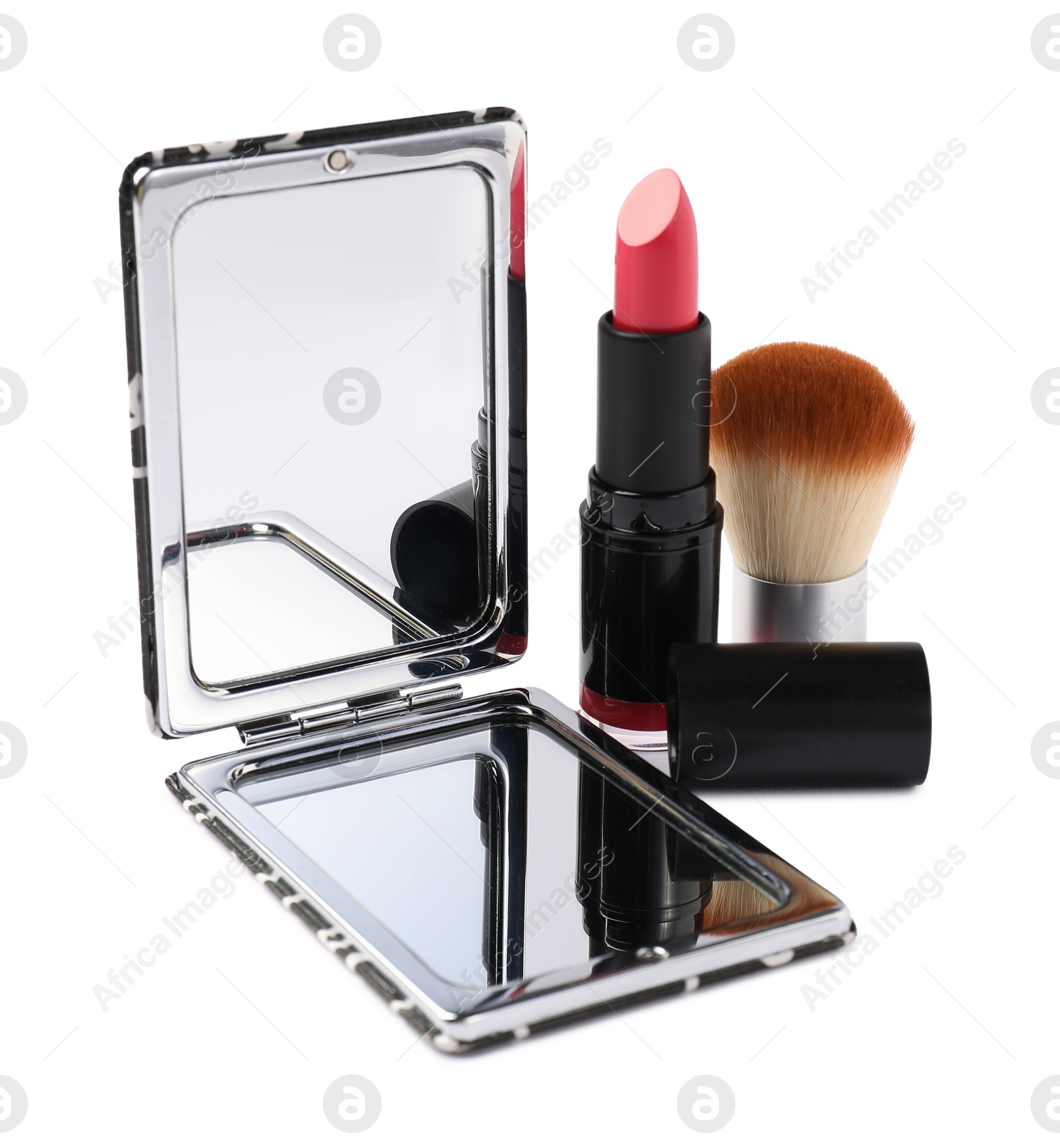 Open pocket mirror, brush and lipstick isolated on white Photo of Open pocket mirror, brush and lipstick isolated on white