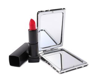 Photo of Open pocket mirror and lipstick isolated on white