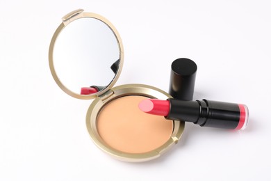 Photo of Open face powder with mirror and lipstick isolated on white