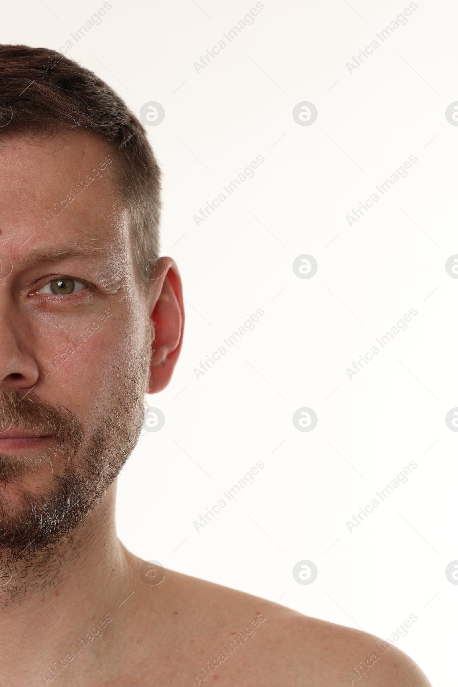 Handsome man with beard on white background Photo of Handsome man with beard on white background