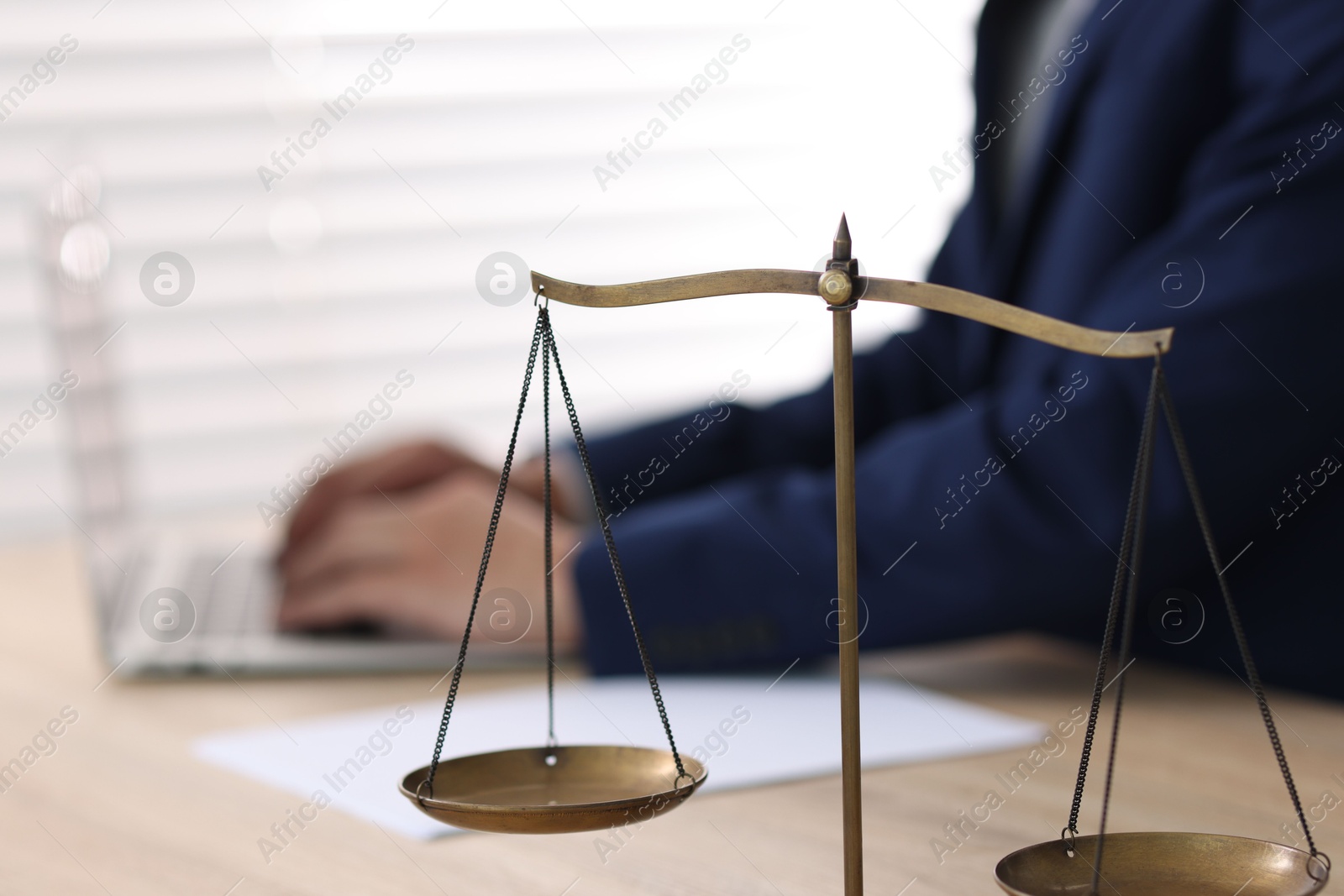 Judge working and scales on desk indoors, selective focus Photo of Judge working and scales on desk indoors, selective focus