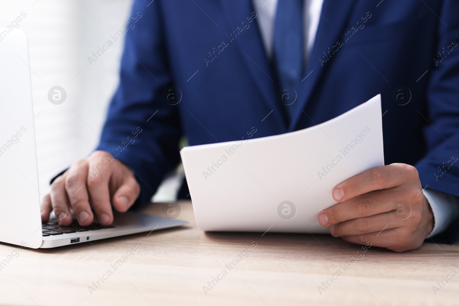 Judge working at wooden desk indoors, closeup Photo of Judge working at wooden desk indoors, closeup