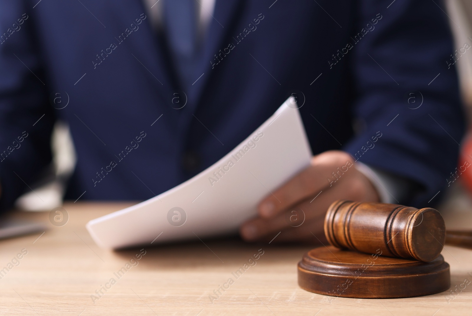 Judge working and gavel on desk indoors, selective focus Photo of Judge working and gavel on desk indoors, selective focus