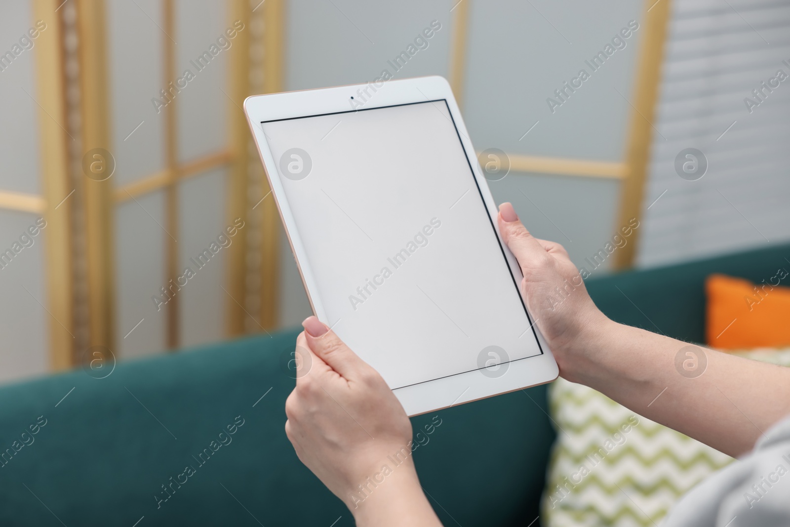 Woman with modern tablet at home, closeup Photo of Woman with modern tablet at home, closeup