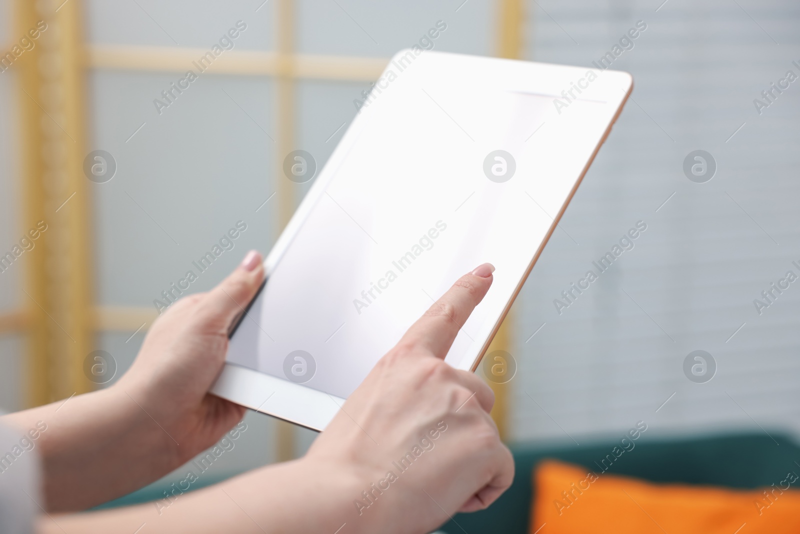 Woman with modern tablet at home, closeup Photo of Woman with modern tablet at home, closeup