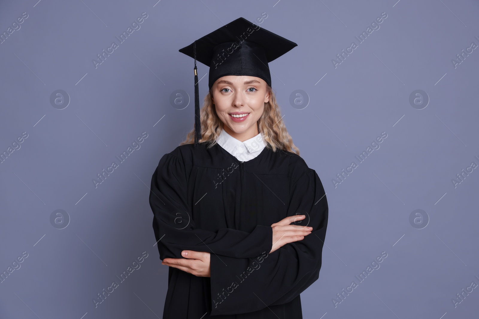 Photo of Happy student after graduation on grey background