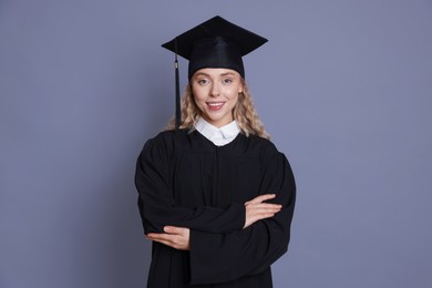 Photo of Happy student after graduation on grey background
