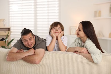 Photo of Parents with their son at home. Lovely family