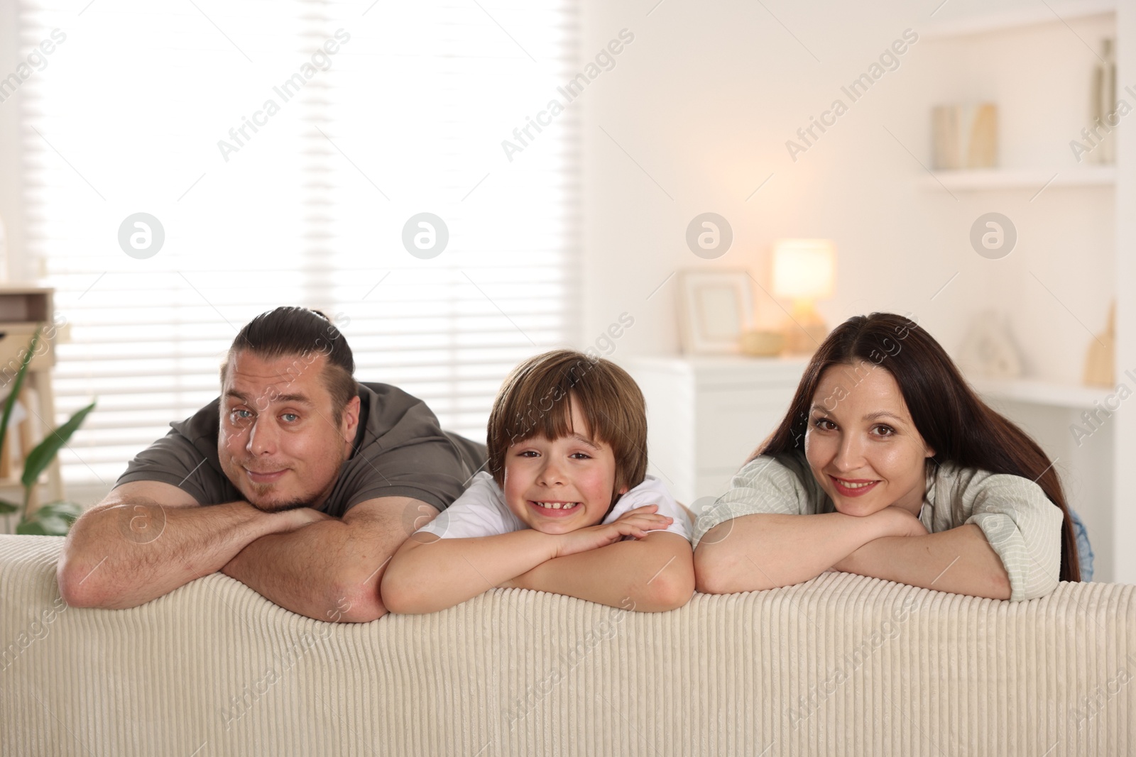 Parents with their son at home. Lovely family Photo of Parents with their son at home. Lovely family