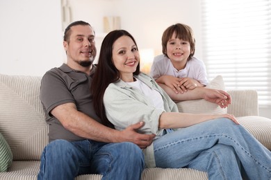 Photo of Parents with their son at home. Lovely family