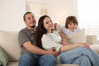 Photo of Parents with their son at home. Lovely family
