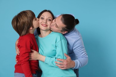 Photo of Portrait of happy family on light blue background