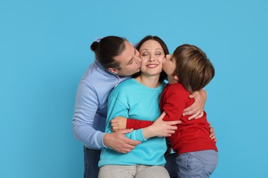 Photo of Portrait of happy family on light blue background