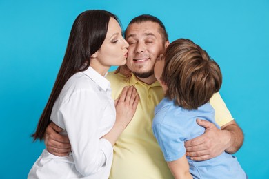 Photo of Portrait of happy family on light blue background