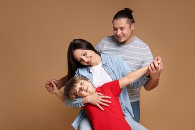 Photo of Portrait of happy family on brown background