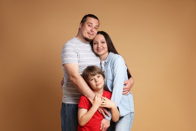 Photo of Portrait of happy family on brown background