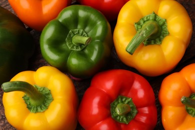 Photo of Fresh colorful bell peppers on table, flat lay