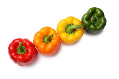 Photo of Fresh colorful bell peppers isolated on white, top view