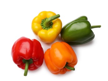 Photo of Fresh colorful bell peppers isolated on white, top view