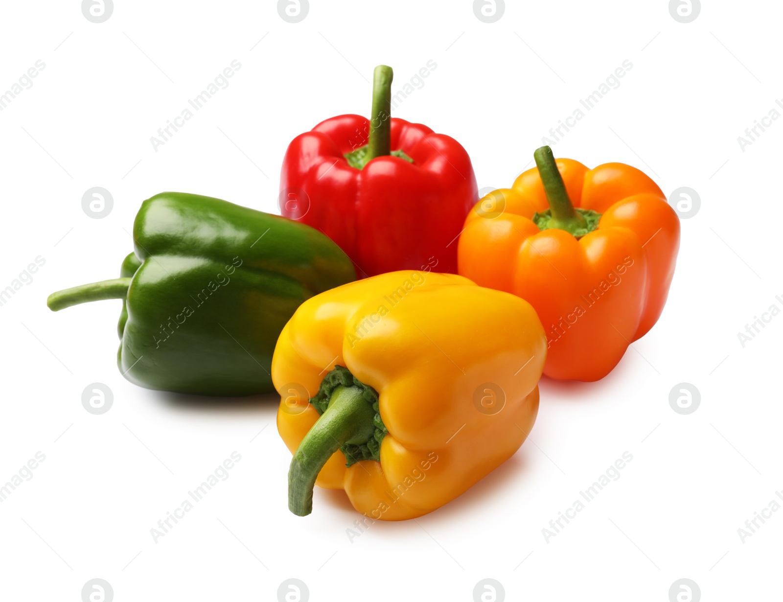 Fresh colorful bell peppers isolated on white Photo of Fresh colorful bell peppers isolated on white