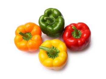 Photo of Fresh colorful bell peppers isolated on white, top view