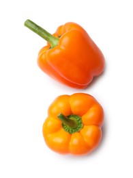 Photo of Fresh orange bell peppers isolated on white, top view