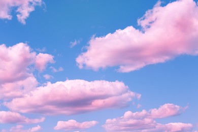 Image of Fluffy color clouds floating in beautiful blue sky