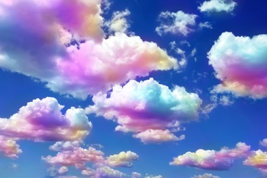 Image of Fluffy color clouds floating in beautiful blue sky