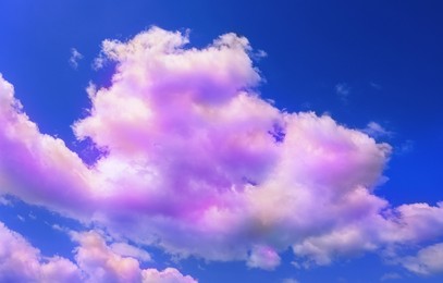 Image of Fluffy color clouds floating in beautiful blue sky