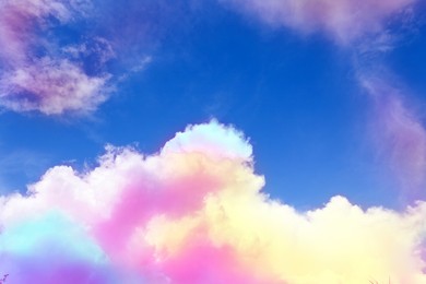 Image of Fluffy color clouds floating in beautiful blue sky