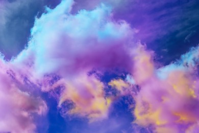 Image of Fluffy color clouds floating in beautiful blue sky