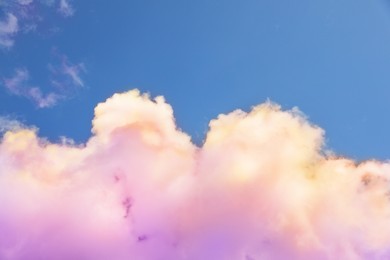 Image of Fluffy color clouds floating in beautiful blue sky